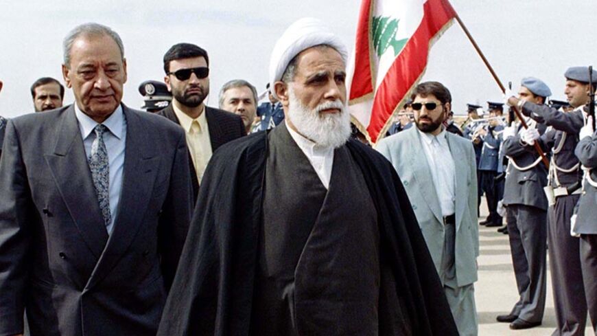 Iranian parliamentary speaker Ali Akbar Nateq Nouri (C) and his Lebanese counterpart Nbih Berri (L) review the presidential guard at Beirut's international airport February 5. Nouri is visiting Lebanon to discuss bilateral relations. [Tehran supports the Islamic Hizbollah (party of God) and its militias in their bid  to oust Israel from the occupation zone in south Lebanon]. - RTXIKOL