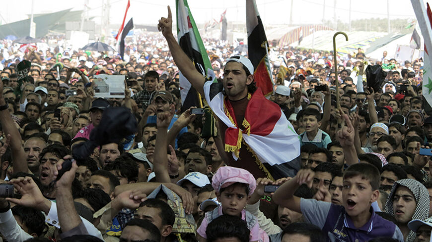 Iraqi Sunni Muslims take part in an anti-government demonstration in Ramadi, 100 km (62 miles) west of Baghdad,April 19, 2013. Thousands of Sunni Muslims protested after Friday prayers in huge rallies against Shi'ite Iraqi Prime Minister Nuri al-Maliki, demanding that he step down. REUTERS/Ali al-Mashhadani (IRAQ - Tags: RELIGION POLITICS CIVIL UNREST) - RTXYSEV