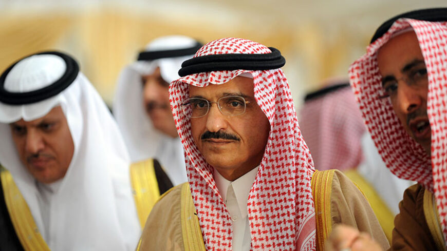 Prince Khaled Bin Bandar Bin Abdul Aziz (C), newly appointed  as Emir of Riyadh region with the rank of minister, listens to explanations during the inauguration of an highway and road tunnels under Riyadh airbase in central Riyadh on March 10, 2013.      AFP PHOTO/FAYEZ NURELDINE