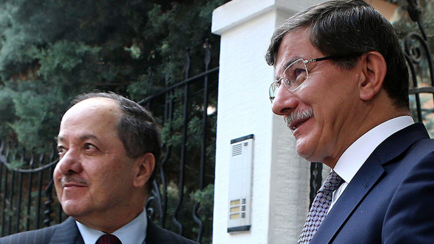 Turkish Foreign Minister Ahmet Davutoglu (R) greets the president of Iraq's autonomous Kurdish region, Massud Barzani, on July 14, 2014 before their meeting in Ankara as Turkey closely watches moves for an independent Iraqi Kurdistan amid the chaos in its conflict-torn neighbor.                      AFP PHOTO / ADEM ALTAN        (Photo credit should read ADEM ALTAN/AFP/Getty Images)
