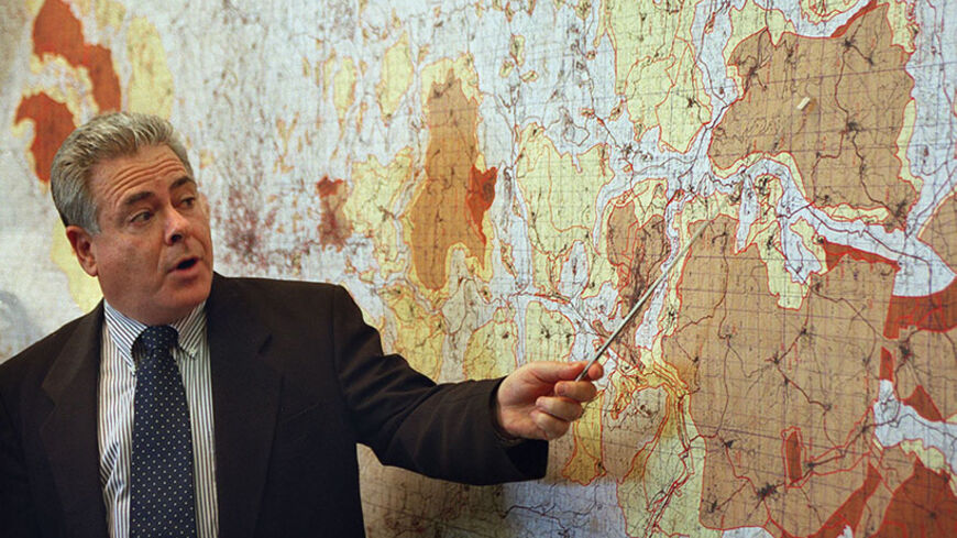 JERUSALEM:Deputy Defence Minister Ephraim Sneh shows journalists in Jerusalem 19 March 2000 the planned Israeli withdrawal from 6.1 percent of the occupied territoris in the West Bank. The Israeli cabinet approved earlier in the day the long-due handover of land to full Palestinian control. (Photo credit should read MENAHEM KAHANA/AFP/Getty Images)