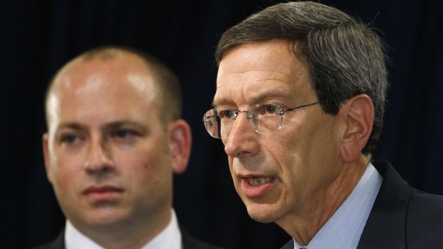 U.S. special adviser for nonproliferation and arms control, Robert Einhorn (R) speaks as Daniel Glaser, the Treasury Department's deputy assistant secretary for terrorist financing and financial crimes looks on during a news conference at the Information Resource Center of the U.S. Embassy in Seoul August 2, 2010. REUTERS/Truth Leem (SOUTH KOREA - Tags: POLITICS MILITARY BUSINESS) - RTR2GZAI