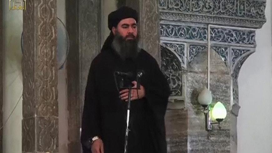 A man purported to be the reclusive leader of the militant Islamic State Abu Bakr al-Baghdadi has made what would be his first public appearance at a mosque in the centre of Iraq's second city, Mosul, according to a video recording posted on the Internet on July 5, 2014, in this still image taken from video. There had previously been reports on social media that Abu Bakr al-Baghdadi would make his first public appearance since his Islamic State in Iraq and the Levant (ISIL) changed its name to the Islamic S
