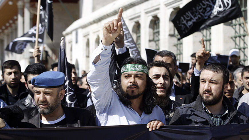 Pro-Islamist protesters shout slogans against the Russian government during a demonstration following the death of North Caucasus rebel leader Doku Umarov, at the courtyard of Fatih mosque in Istanbul March 21, 2014. Russia's most wanted man, Doku Umarov, is dead and has been replaced as the leader of an Islamist insurgency in the North Caucasus, a website that sympathises with the militants said on Tuesday. Umarov's forces have claimed responsibility for several deadly bombings, including in Moscow. His de