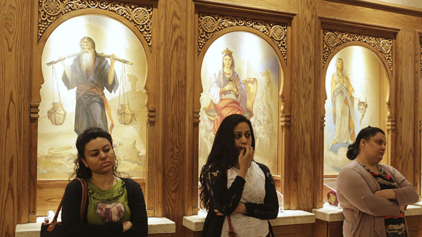 Copts attend a church session during Easter Holy week in central Cairo April 15, 2014 REUTERS/Asmaa Waguih (EGYPT - Tags: RELIGION) - RTR3LFKV
