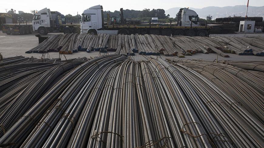 Iron rods ready for shipment are piled at Israel Shipyards Port in Haifa February 5, 2014. Three years after Syria plunged into violence, Israel is reaping an unlikely economic benefit. Exports from Turkey have begun to flow through Israel and across the Sheikh Hussein Bridge to Jordan and a few Arab neighbours. The trade is growing enough to encourage long-held Israeli hopes that the Jewish state can become a commercial gateway to the Arab world. Picture taken February 5, 2014. To match Insight ISRAEL-TRAD