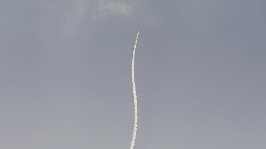 A smoke trail is seen as a rocket is launched from the northern Gaza Strip towards Israel July 15, 2014. Israel resumed air strikes in the Gaza Strip on Tuesday after agreeing to an Egyptian-proposed ceasefire deal that failed to get Hamas militants to halt rocket attacks. The week-old conflict seemed to be at a turning point, with Hamas defying Arab and Western calls to cease fire and Israel threatening to step up an offensive that could include an invasion of the densely populated enclave of 1.8 million.