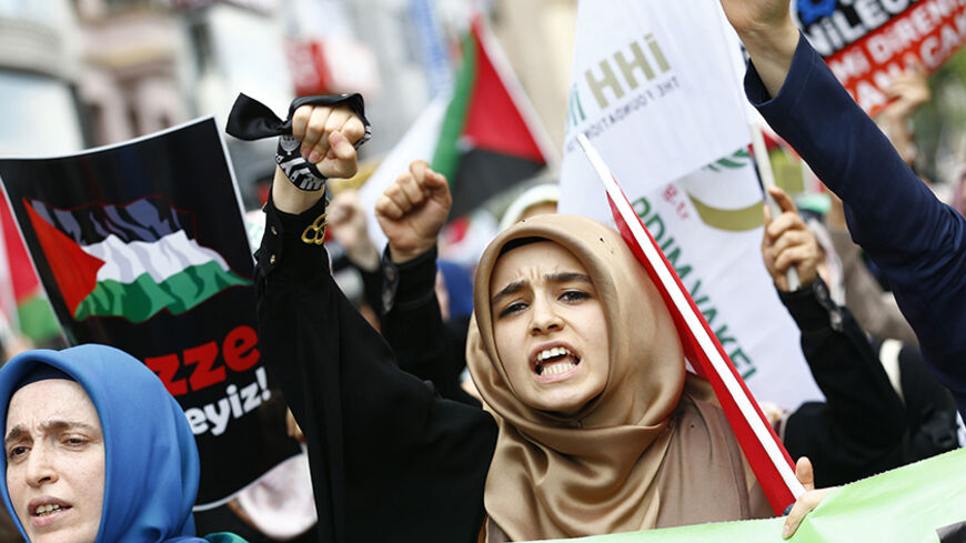 Pro-Palestinian demonstrators shout slogans as they protest against Israel's military action in Gaza, after Friday prayers at the courtyard of Fatih mosque in Istanbul July 18, 2014. Israel stepped up its land offensive in the Gaza Strip with artillery, tanks and gunboats on Friday after Islamist militants there rejected a proposed truce and kept firing rockets into the Jewish state. REUTERS/Murad Sezer (TURKEY - Tags: POLITICS CIVIL UNREST) - RTR3Z858