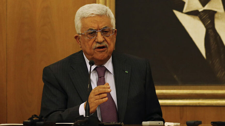 Turkey's President Abdullah Gul (R) and Palestinian President Mahmoud Abbas attend a news conference following their meeting at Ataturk International airport in Istanbul July 18, 2014. A portrait of modern Turkey's founder Ataturk is in the background. REUTERS/Murad Sezer (TURKEY - Tags: POLITICS) - RTR3Z8NN