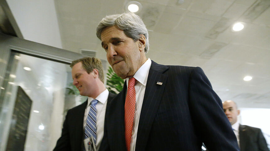U.S. Secretary of State John Kerry arrives to brief members of the U.S. Senate on talks with Iran during a closed-door meeting at the Capitol in Washington, December 11, 2013. REUTERS/Jonathan Ernst (UNITED STATES - Tags: POLITICS MILITARY) - RTX16EEK