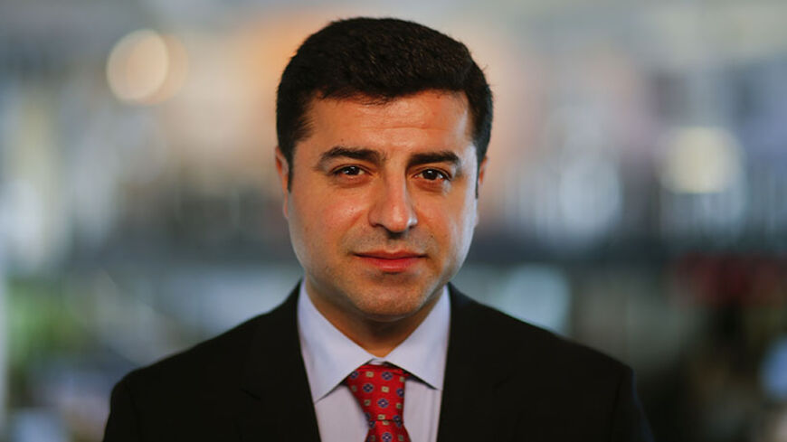 Selahattin Demirtas, co-chairman of the pro-Kurdish Peace and Democracy Party (BDP) answers a question during a Reuters interview in Berlin April 15, 2013. A top Kurdish politician said on Monday it would be difficult for Kurdish fighters to disarm before leaving Turkey under a peace process, stressing that the key issue was that they depart peacefully without contact with the Turkish military. Prime Minister Tayyip Erdogan's government is seeking a weapons-free pullout by militants of the Kurdistan Workers