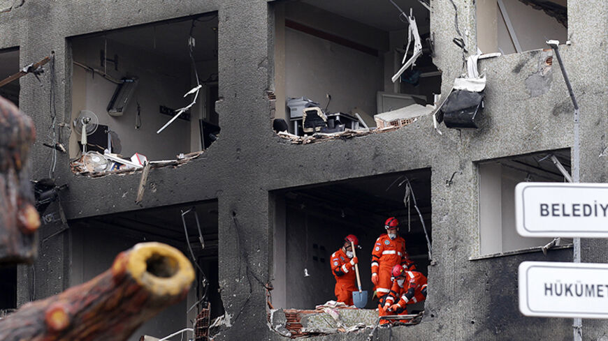Search and rescue team members work on one of the scenes of the twin car bomb attacks in the town of Reyhanli of Hatay province near the Turkish-Syrian border May 12, 2013. Twin car bombs killed 43 people and wounded many more in a Turkish town near the Syrian border on Saturday and the government said it suspected Syrian involvement. The bombing increased fears that Syria's civil war was dragging in neighbouring states despite renewed diplomatic moves towards ending two years of fighting in which more than