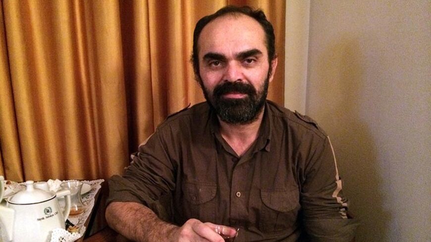 Bunyamin Aygun, a Turkish photographer kidnapped while covering the civil war in neighbouring Syria, poses after he has been freed on January 5, 2014 in Hatay. Aygun, who works for the newspaper Milliyet, was taken hostage by radical Islamists late last year during a reporting mission in the war-torn country. He was freed on January 5 and will soon return to Turkey, the Anatolia news agency said, citing Turkish sources.AFP PHOTO/YURTTAS TUMER (Photo credit should read YURTTAS TUMER/AFP/Getty Images)