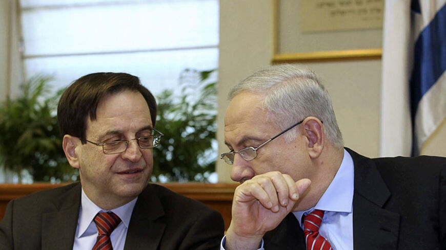 Israel's Prime Minister Benjamin Netanyahu speaks with Deputy Prime Minister Dan Meridor (L) during the weekly cabinet meeting in Jerusalem January 17, 2010.    REUTERS/Gali Tibbon/Pool   (JERUSALEM - Tags: POLITICS) - RTR28YSN