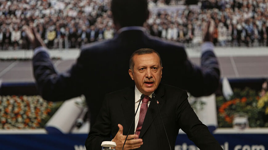 Turkey's Prime Minister and leader of Justice and Development Party (AKP) Tayyip Erdogan makes a speech during a party meeting in Istanbul September 22, 2012. The party's September 30, 2012 congress is unlikely to offer any sign Erdogan, viewed by many Turks as their strongest leader since Ataturk, is loosening his grip on a heavily-centralised party or on the country as a whole. Picture taken September 22, 2012. To match story TURKEY-AKP/ REUTERS/Murad Sezer (TURKEY - Tags: POLITICS) - RTR38FHK