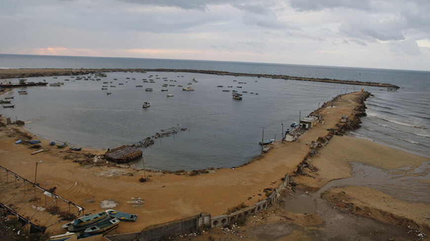 Fishing boats are seen at Gaza Seaport in Gaza City November 24, 2012. Israel eased restrictions on Gaza fishermen on Saturday, further implementing a three-day-old truce brokered by Egypt after a week of fierce fighting, Palestinian officials said. REUTERS/Ahmed Zakot (GAZA - Tags: POLITICS CIVIL UNREST CONFLICT) - RTR3ATKD