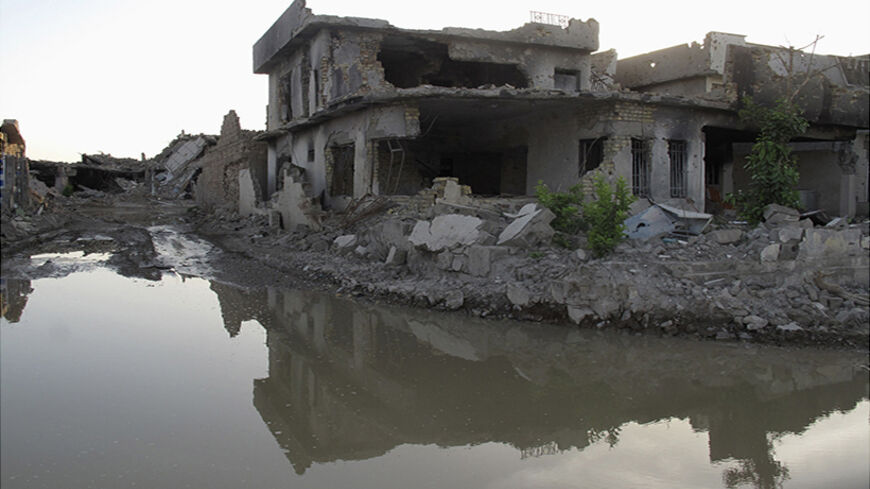 A view of damaged houses during a patrol in the city of Ramadi, 100 km (62 miles) west of Baghdad, May 5, 2014. Iraqi forces are locked in a four-month fight with al Qaeda offshoot the Islamic State of Iraq and the Levant (ISIL) for the cities of Ramadi and Fallujah. Picture taken May 5, 2014. REUTERS/Stringer (IRAQ - Tags: CIVIL UNREST POLITICS CONFLICT MILITARY) - RTR3O0MV
