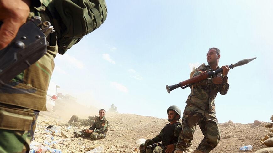 Kurdish "peshmerga" troops take part in an intensive security deployment against Islamic State militants, on the outskirts of the province of Nineveh, August 6, 2014. Islamic State militants extended their gains in northern Iraq on Thursday, seizing three more towns and gaining a foothold near the Kurdish region, witnesses said. The advance came after the Sunni militants inflicted a humiliating defeat on Kurdish forces in a weekend sweep in the north. The Islamic State, which has declared a caliphate in par