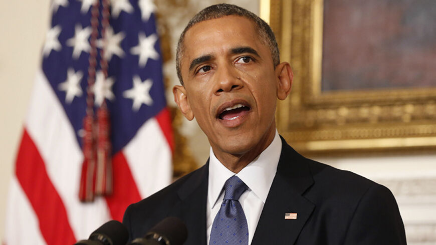 U.S. President Barack Obama talks about the humanitarian relief situation in Iraq, at the State Dining Room of the White House in Washington August 7, 2014. REUTERS/Larry Downing (UNITED STATES - Tags: POLITICS) - RTR41N39