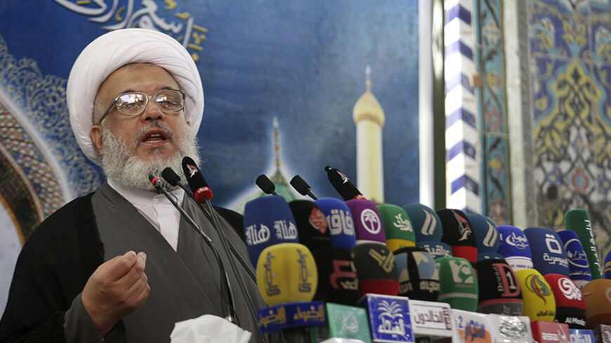 Sheikh Abdul Mehdi Al-Karbala'i speaks as he delivers the text of a sermon by Iraq's top Shi'ite cleric Grand Ayatollah Ali al-Sistani, during Friday prayers at the Imam Hussein shrine in the holy city of Kerbala August 8, 2014. Sistani called again on compatriots on Friday to unite against the "big danger" posed by Islamic State militants, whose advances prompted U.S. President Barack Obama to authorise limited bombing. In a weekly Friday sermon delivered through the spokesman in the sacred Shi'ite city of