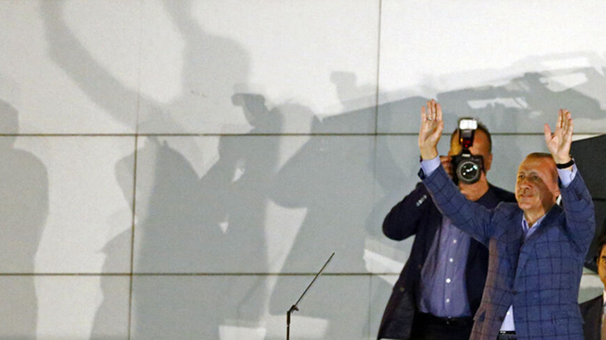 Turkey's Prime Minister Tayyip Erdogan gestures as he celebrates his election victory in front of the party headquarters in Ankara August 10, 2014. Erdogan secured his place in history as Turkey's first directly elected president on Sunday, sweeping more than half the vote in a result his opponents fear heralds an increasingly authoritarian state. REUTERS/Murad Sezer (TURKEY  - Tags: POLITICS ELECTIONS)   - RTR41W60