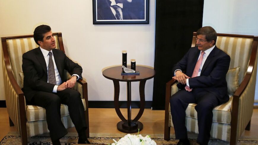 Turkey's Foreign Minister Ahmet Davutoglu (R) meets with Iraq's Kurdish Regional Government (KRG) Prime Minister Nechirvan Barzani in Ankara July 30, 2013.    REUTERS/Umit Bektas (TURKEY - Tags: POLITICS) - RTX1252R