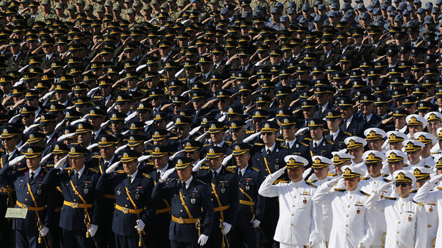 Turkish soldiers salute during a ceremony marking the 91st anniversary of Victory Day at the mausoleum of Mustafa Kemal Ataturk, founder of modern Turkey, in Ankara August 30, 2013. REUTERS/Umit Bektas (TURKEY - Tags: POLITICS MILITARY) - RTX131DP