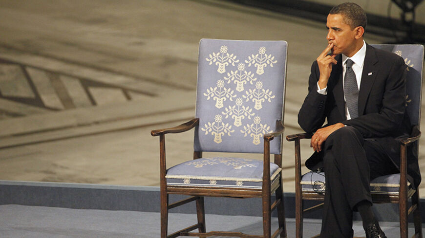 Nobel Peace Prize laureate U.S. President Barack Obama listens to a performance during the Nobel Peace Prize award ceremony at Oslo City Hall December 10, 2009. The Nobel committee is awarding the peace prize to Obama for "his extraordinary efforts to strengthen international diplomacy and cooperation between peoples" and cited his push for nuclear disarmament. REUTERS/Thomas Peter (NORWAY) - RTXRP1N