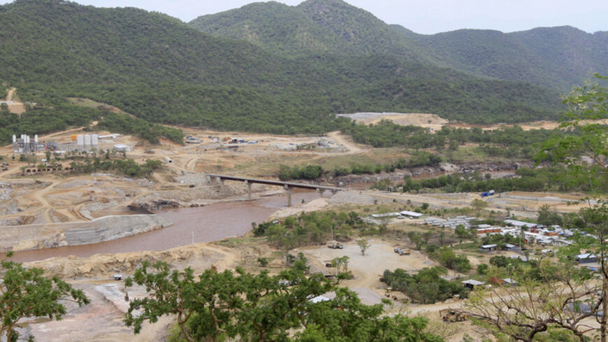 Ethiopia's Great Renaissance Dam is constructed in Guba Woreda, some 40 km (25 miles) from Ethiopia's border with Sudan, June 28, 2013. Egypt fears the $4.7 billion dam, that the Horn of Africa nation is building on the Nile, will reduce a water supply vital for its 84 million people, who mostly live in the Nile valley and delta. Picture taken June 28, 2013. REUTERS/Tiksa Negeri (ETHIOPIA - Tags: POLITICS SOCIETY ENERGY ENVIRONMENT) - RTX115KB