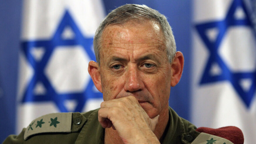 Israeli army Chief of Staff Benny Gantz gestures during a press conference at the Defence Ministry in Tel Aviv on July 28, 2014. Prime Minister Benjamin Netanyahu said Israelis must be ready for a long military campaign in Gaza, after mortar fire from the enclave killed four people in the Jewish state. AFP PHOTO/GIL COHEN-MAGEN (Photo credit should read GIL COHEN MAGEN/AFP/Getty Images)
