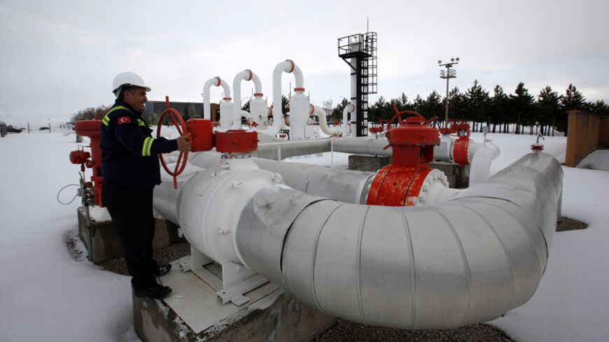 A worker checks the valve gears in a natural gas control centre of Turkey's Petroleum and Pipeline Corporation, 35 km (22 miles) west of Ankara, February 14, 2012. REUTERS/Umit Bektas (TURKEY - Tags: BUSINESS ENERGY) - RTR2XU1J