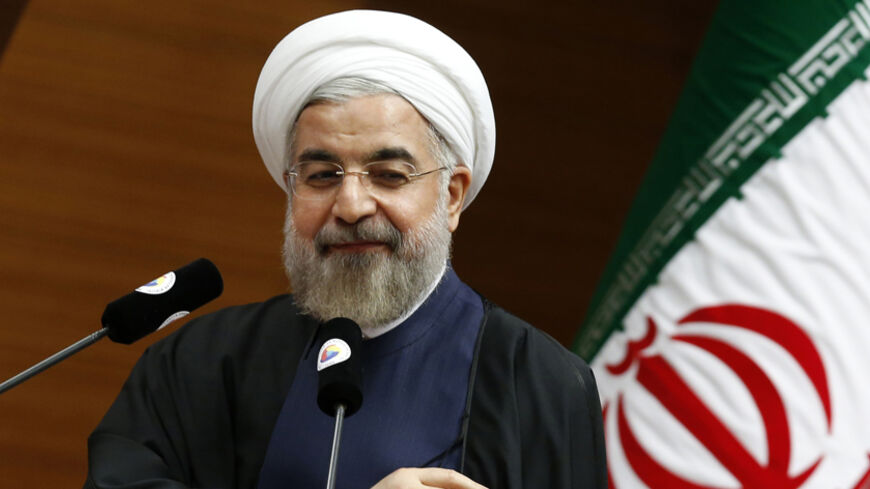 Iran's President Hassan Rouhani addresses the audience during a meeting in Ankara June 10, 2014. REUTERS/Umit Bektas (TURKEY - Tags: POLITICS) - RTR3T16B
