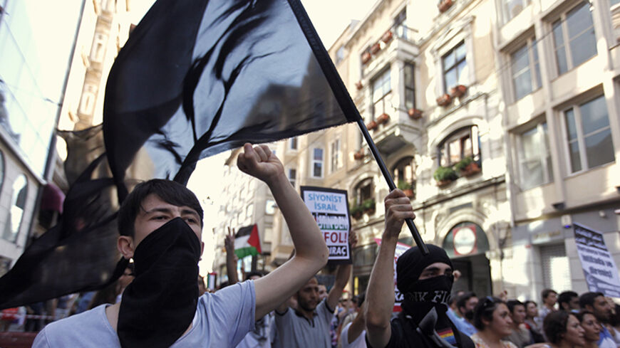 Pro-Palestinian demonstrators march to protest Israeli military strikes on Gaza, during a rally in central Istanbul July 13, 2014. Thousands fled their homes in a Gaza town on Sunday after Israel warned them to leave ahead of threatened attacks on rocket-launching sites, on the sixth day of an offensive that Palestinian officials said has killed at least 160 people. Militants in the Hamas-ruled Gaza Strip kept up rockets salvoes deep into the Jewish state and the worst bout of Israel-Palestinian bloodshed i