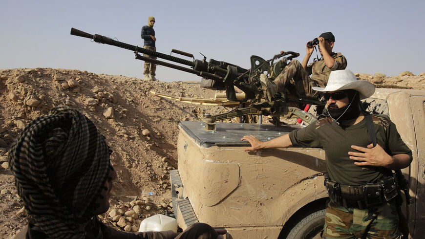 Kurdish Peshmerga fighters guard their position on the Jalawla front line in the northeastern district of Baquba near the city of Khanaqin August 29, 2014.  REUTERS/Youssef Boudlal (IRAQ - Tags: POLITICS CONFLICT MILITARY TPX IMAGES OF THE DAY) - RTR44A3W