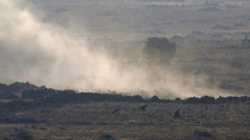 Syrian army soldiers leave their position after it was bombed by rebel fighters during a battle in Syria near the border fence with the Israeli-occupied Golan Heights September 1, 2014. Heavy fighting between Syrian army forces and rebels erupted on the Golan Heights on Monday, a Reuters photographer said, but it was unclear if either of the two sides had gained an advantage to control a key frontier crossing. REUTERS/Baz Ratner (SYRIA - Tags: CIVIL UNREST POLITICS MILITARY) - RTR44H7H