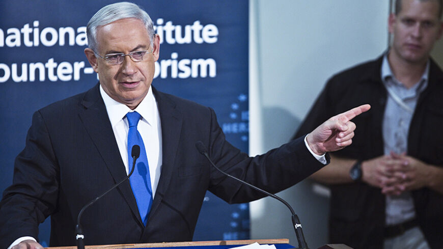 Israel's Prime Minister Benjamin Netanyahu speaks during a conference on counter-terrorism at the Interdisciplinary Center in Herzliya, near Tel Aviv September 11, 2014. Netanyahu said on Thursday he would increase the defence budget to meet growing threats but not let the country's credit rating drop one notch through any excessive spending. REUTERS/Nir Elias (ISRAEL - Tags: POLITICS MILITARY BUSINESS) - RTR45VNS