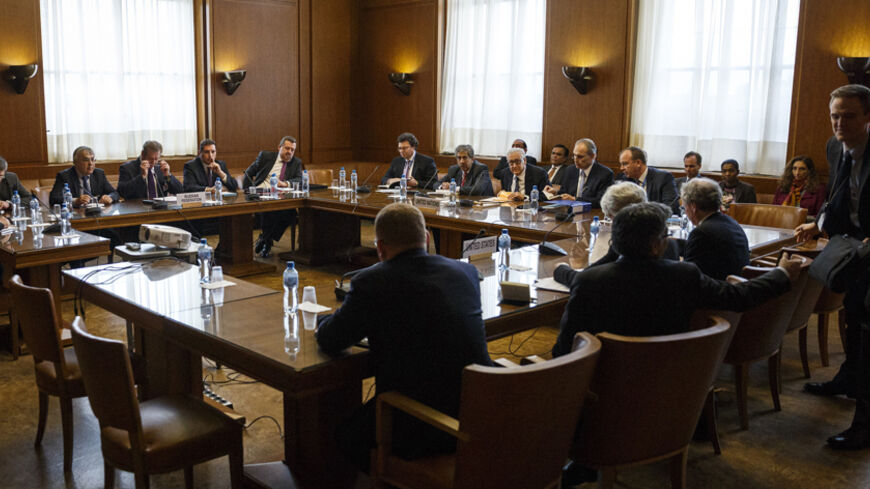 Representatives sit at the start of a trilateral meeting between U.S. Under Secretary of State Wendy Sherman, UN-Arab League envoy for Syria Lakhdar Brahimi and Russian Deputy Minister of Foreign Affairs Gennady Gatilov during the second round of negotiations between the Syrian government and the opposition at the European headquarters of the United Nations, in Geneva, Switzerland, February 13, 2014. REUTERS/Valentin Flauraud/Pool (SWITZERLAND - Tags: POLITICS) - RTX18R98