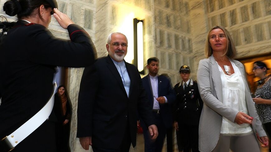 Italy's Foreign Minister Federica Mogherini (R) arrives for a news conference with her Iranian counterpart Mohammad Javad Zarif (2nd L) during a meeting in Rome, September 3, 2014.
REUTERS/Alessandro Bianchi (ITALY - Tags: POLITICS) - RTR44TAF