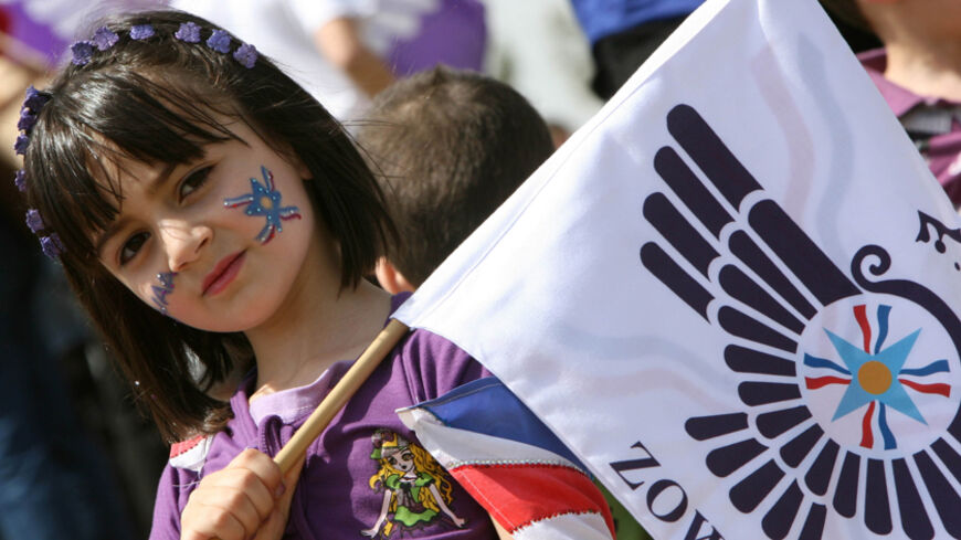 An Iraqi Christian Assyrian girl joins in New Year (Aketo) celebrations on April 01, 2011, in the northern Iraqi city of Dohuk, 500 kilometers north of the capital Baghdad. Descendants of Iraq's ancient Assyrians are enjoying the start of parties and parades to celebrate their New Year, a pagan rite that glorifies resurrection and life and dates back millennia. AFP PHOTO/SAFIN HAMED (Photo credit should read SAFIN HAMED/AFP/Getty Images)