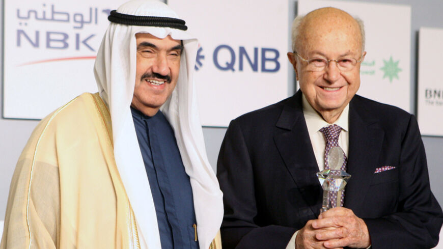 Kuwaiti Prime Minister Sheikh Nasser al-Mohammad al-Sabah (L), honours Said Khoury, chairman of the Consolidated Contractors group of Companies (CCC), during the opening session of the 3rd Kuwait Financial Forum in Kuwait City on October 31,2011. AFP PHOTO/YASSER AL-ZAYYAT (Photo credit should read YASSER AL-ZAYYAT/AFP/Getty Images)