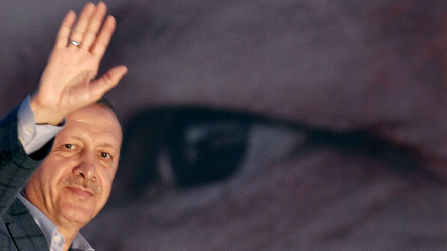 Turkey's Prime Minister Tayyip Erdogan waves to the crowd in Istanbul August 10, 2014. Erdogan?said on Sunday the Turkish people had "shown their will" in a presidential election which local media and allies said he had won, but stopped short of formally declaring victory, saying he would make a full statement later. REUTERS/Osman Orsal (TURKEY - Tags: POLITICS ELECTIONS TPX IMAGES OF THE DAY) - RTR41VSV