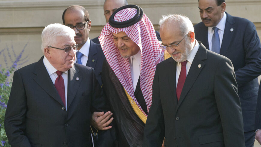 Iraq's President Fouad Massoum (L) talks with Saudi Arabian Foreign Minister Prince Saud al-Faisal (C) and Iraqi Foreign Minister Ibrahim al-Jaafari as they arrive for a family photo during the International Conference on Peace and Security in Iraq, at the Quai d'Orsay in Paris September 15, 2014. French President Hollande called on Monday for a global response to counter Islamic State militants during an International conference bringing together about 30 countries to discuss how to cooperate in the figh