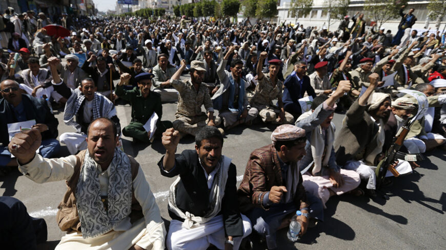 Followers of the Shi'ites Houthi group shout slogans as they celebrate Eid al-Ghadir in Sanaa October 12, 2014. The celebration marks al-Ghadir day, a day Shi'ites believe Prophet Muhammad nominated his cousin, Imam Ali, to be his successor. REUTERS/Khaled Abdullah (YEMEN - Tags: RELIGION ANNIVERSARY) - RTR49UNU