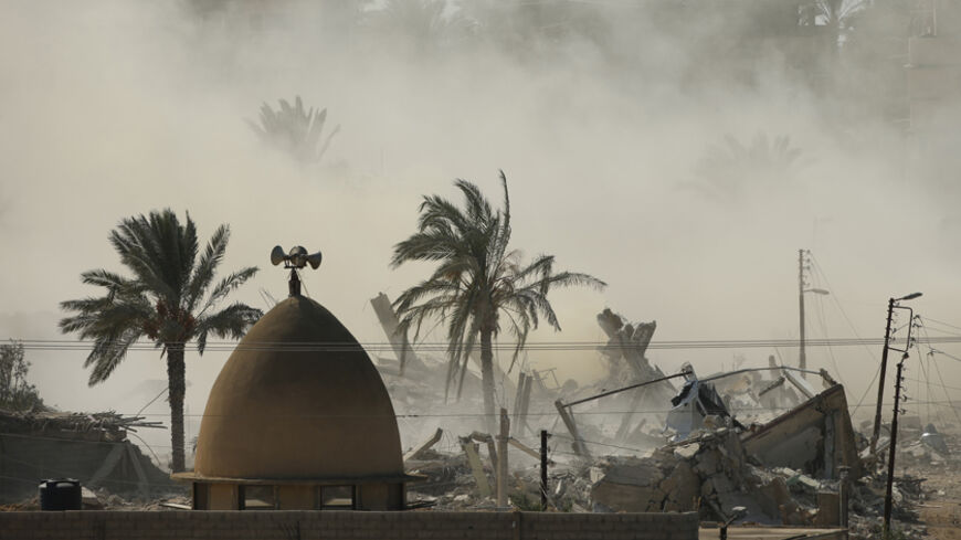 Smoke rises after a house is blown up during a military operation by Egyptian security forces in the Egyptian city of Rafah, near the border with southern Gaza Strip October 29, 2014. At least 33 Egyptian security personnel were killed on Friday in the Sinai Peninsula bordering Israel and Gaza, in an attack on a checkpoint that bore the marks of assaults claimed by Egypt's most active militant group Ansar Bayt al-Maqdis. Egypt's President Abdel Fattah al-Sisi said on Saturday the military would respond with