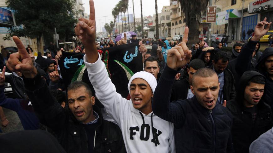 Palestinians take part in an anti-Israel rally over the entry restrictions to the al-Aqsa mosque, in the West Bank city of Hebron October 31, 2014. Muslim men over 50 prayed at the Aqsa mosque in Jerusalem's Old City on Friday amid intense security, a day after Israel closed all access to the sacred compound for the first time in more than a decade following violence on the streets. REUTERS/Mussa Qawasma (WEST BANK - Tags: POLITICS CIVIL UNREST RELIGION) - RTR4CBH7