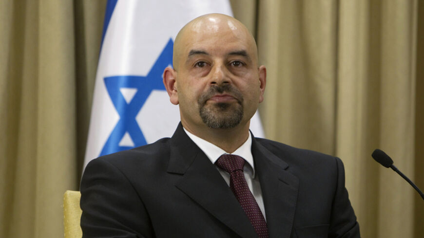 Jordan's new ambassador to Israel Walid Khalid Abdullah Obeidat sits with Israel's President Shimon Peres (not seen) after presenting him with his credentials in Jerusalem October 17, 2012. In a ceremony at Peres' official residence in Jerusalem, the new Jordanian ambassador formally took up his post on Wednesday, filling a diplomatic slot that had been empty for the past two years, in apparent displeasure over the collapse of Israeli-Palestinian peace talks. REUTERS/Ronen Zvulun (JERUSALEM - Tags: POLITICS
