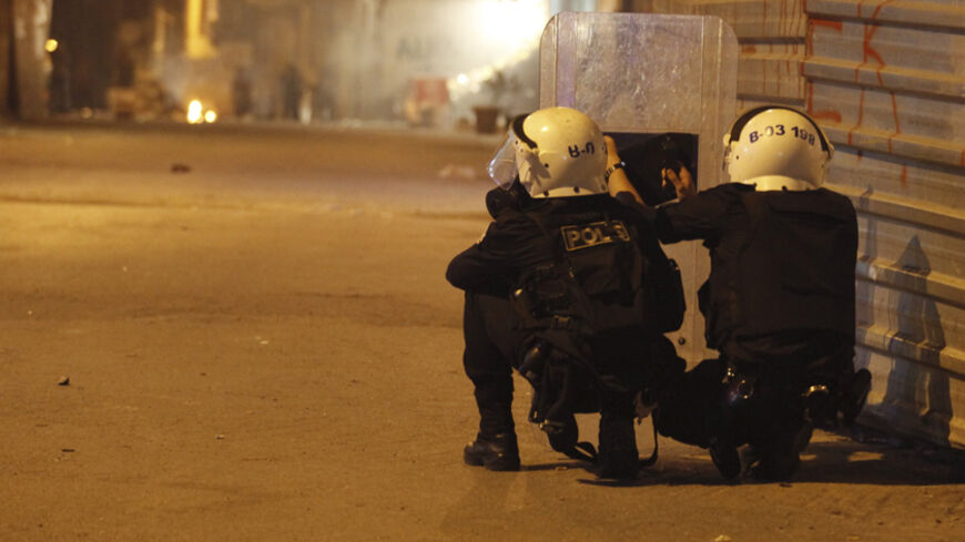 Riot police take up positions as they clash with protesters in Istanbul, during a pro-Kurdish demonstration in solidarity with the people of the Syrian Kurdish town of Kobani, October 7, 2014. Turkey's president said Kobani was "about to fall" as Islamic State fighters pressed home a three-week assault that has cost a reported 400 lives and forced thousands to flee their homes. REUTERS/Osman Orsal (TURKEY - Tags: CIVIL UNREST POLITICS) - RTR49AXB