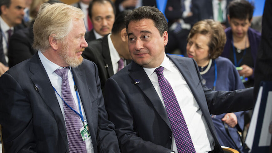 Russia's Deputy Finance Minister Sergei Storchak (L) and Turkey's Deputy Prime Minister Ali Babacan speak before a meeting of the International Monetary and Financial Committee (IMFC) at the World Bank/IMF annual meetings in Washington October 11, 2014.      REUTERS/Joshua Roberts    (UNITED STATES - Tags: POLITICS BUSINESS) - RTR49SF9