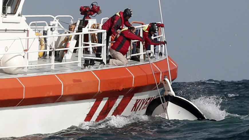 Rescuers retrieve a boat that sank off the Black Sea village of Garipce near Istanbul November 3, 2014. Rescuers pulled 24 dead bodies from the sea at the mouth of Istanbul's Bosphorus strait on Monday and rescued seven people after the boat carrying a group of migrants sank, the Turkish Coastguard Command said. Seven coastguard vessels and a helicopter were continuing search operations in the Black Sea, some 3 miles (5 km) north of the Bosphorus, the coastguard said in a statement. Media reports said some