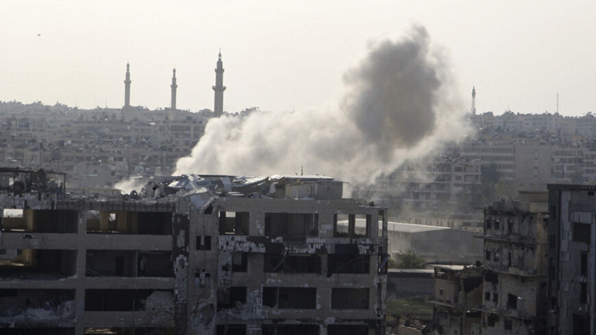 Smoke rises from al-Khalidiya neighbourhood, where forces loyal to Syria's president Bashar Al-Assad are located, during what activists said was shelling by Free Syrian Army fighters from Bani Zeid neighbourhood, in Aleppo November 10, 2014. REUTERS/Abdalrhman Ismail (SYRIA - Tags: POLITICS CIVIL UNREST CONFLICT) - RTR4DM55